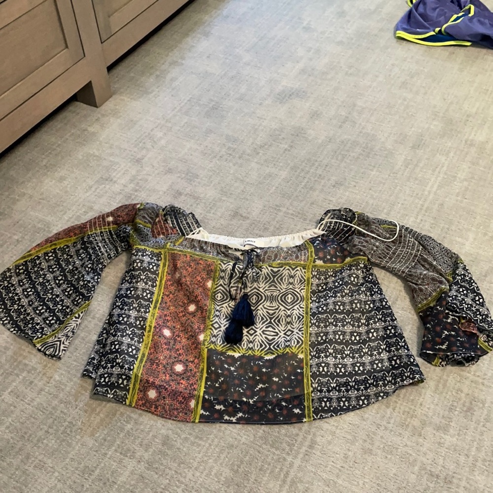 Likely flowy top